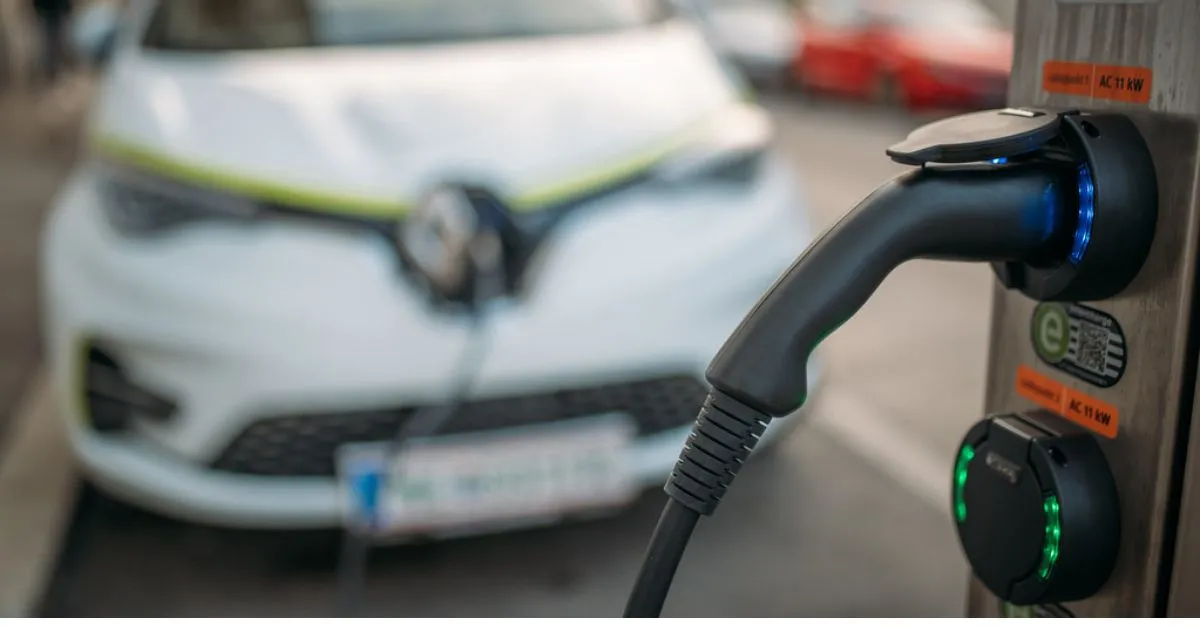 Modern electric vehicle charging station with EVs charging