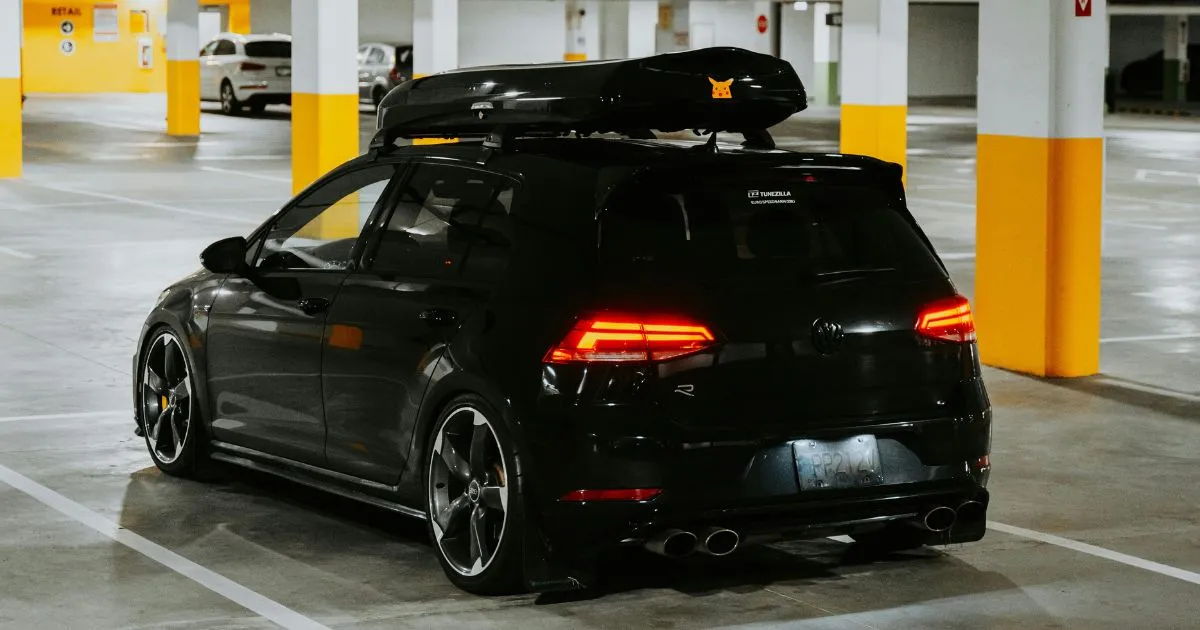 A Black Car Parked In A Garage Using Parkopedia Services A Black Car Parked In A Garage Using Parkopedia Services