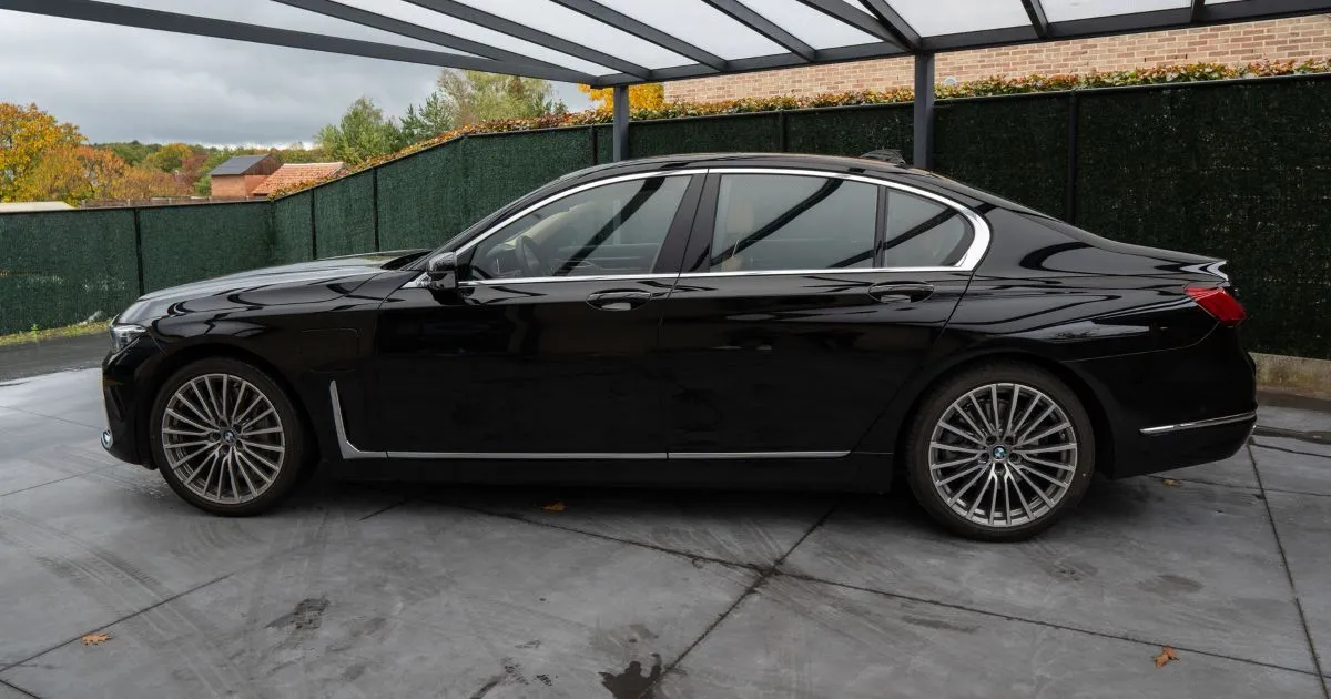A Black Car Parked In A Well-Managed Rented Parking Space
