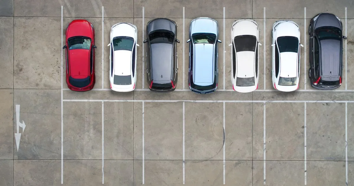 A Clean Parking Lot With Clear Markings And Signs