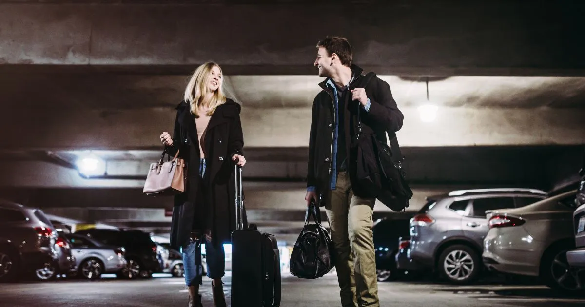 A Couple After Parking Their Vehicle In A Reliable Parking Garage Near Airport A Couple After Parking Their Vehicle In A Reliable Parking Garage Near Airport