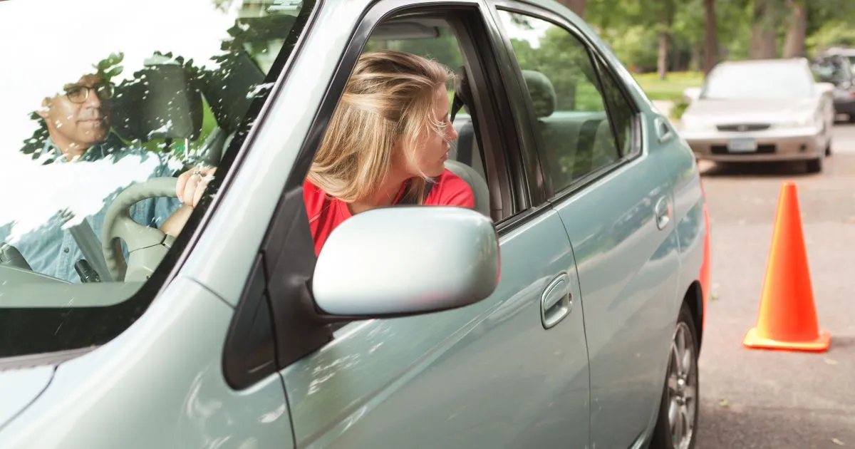 A Female Driver Parking Her Vehicle In A Pre-Booked Parking Space