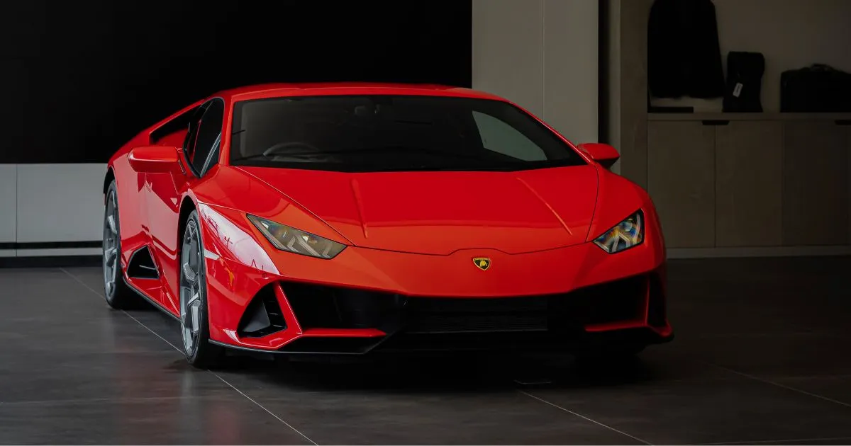 A Legally Parked Red Sports Car In An Indoor Parking Garage A Legally Parked Red Sports Car In An Indoor Parking Garage