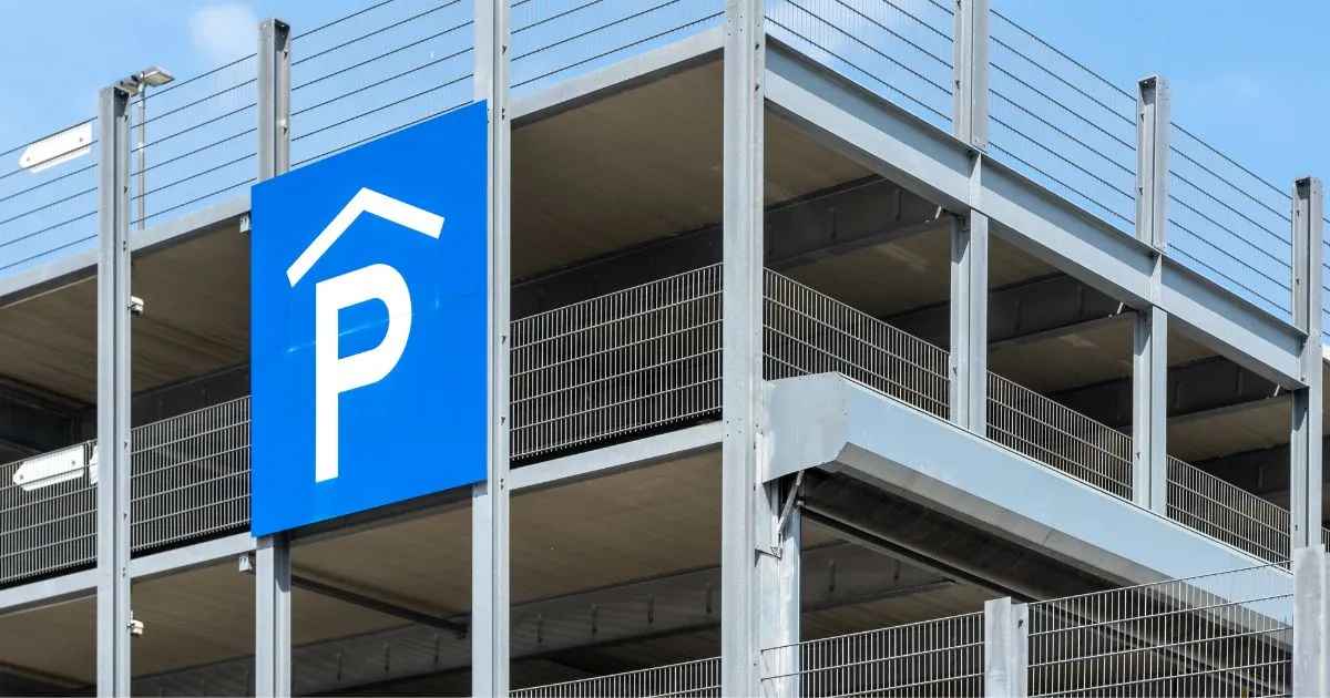 A Multi Level Car Park With A Parking Sign For Guiding Drivers