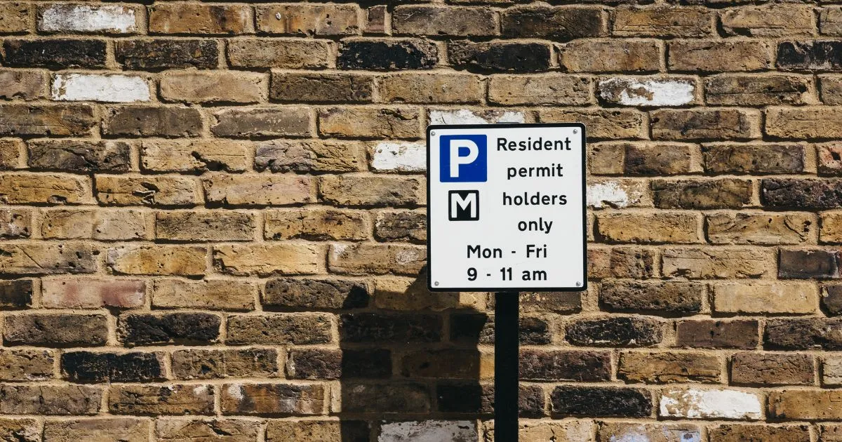 A Parking Sign With Multiple Indications