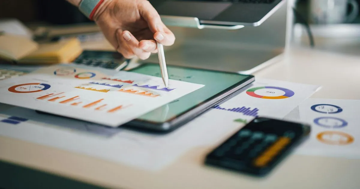 A Professional Working On Calculating Costs For Parking App Development