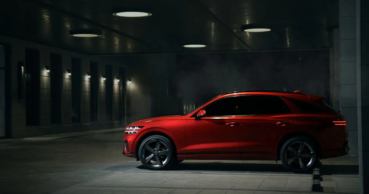 A Red Car Parked In A Parking Garage With Spaces Available For Many Other Vehicles