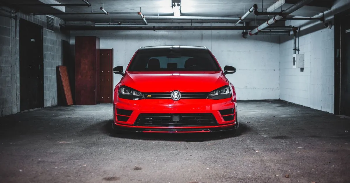 A Red Car Parked In A Rented Covered Parking Space A Red Car Parked In A Rented Covered Parking Space