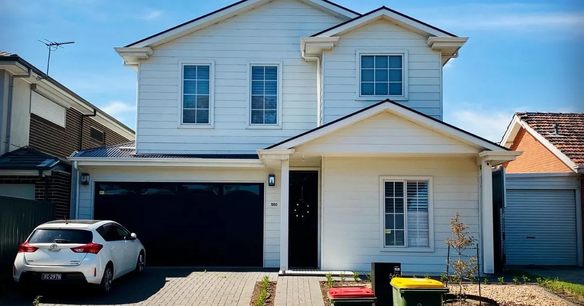 A White Car Parked In A Residential Parking Space On Rent A White Car Parked In A Residential Parking Space On Rent