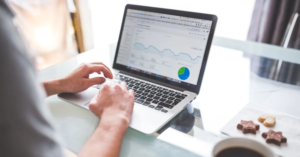 An Entrpreneur Using Google Ads On His Computer Tracking Ad Campaigns