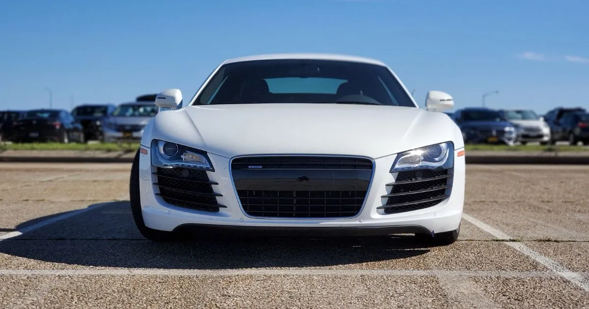 An Uncovered Parking Lot With Multiple Parked Vehicles Of Those Attending An Event An Uncovered Parking Lot With Multiple Parked Vehicles Of Those Attending An Event