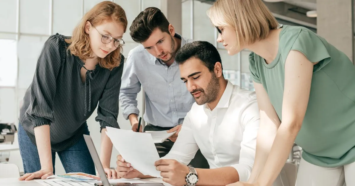 Company Officials Discussing Marketing Plan For Their Parking Rental Company Company Officials Discussing Marketing Plan For Their Parking Rental Company