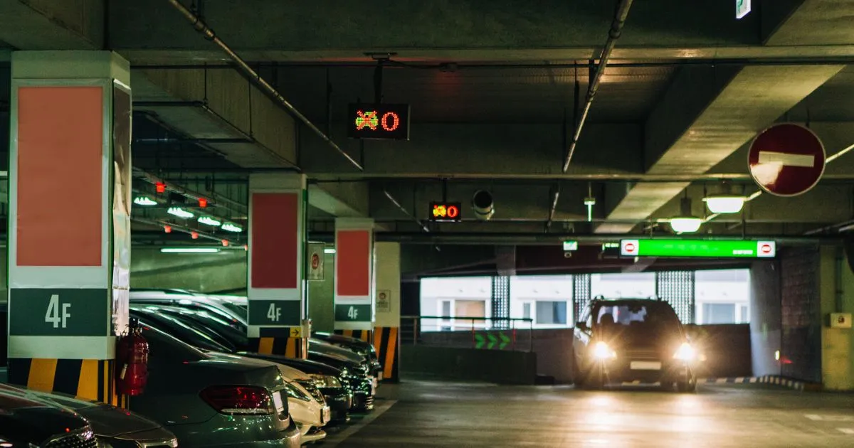 Dimly Lit Parking Garage with No Vacant Spots Dimly Lit Parking Garage with No Vacant Spots