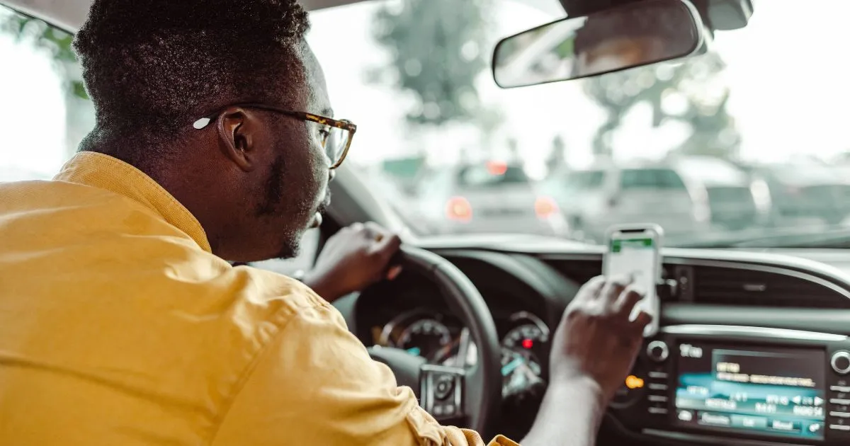 Driver Using Real-Time Parking App To Find Available Spaces Efficiently Driver Using Real-Time Parking App To Find Available Spaces Efficiently