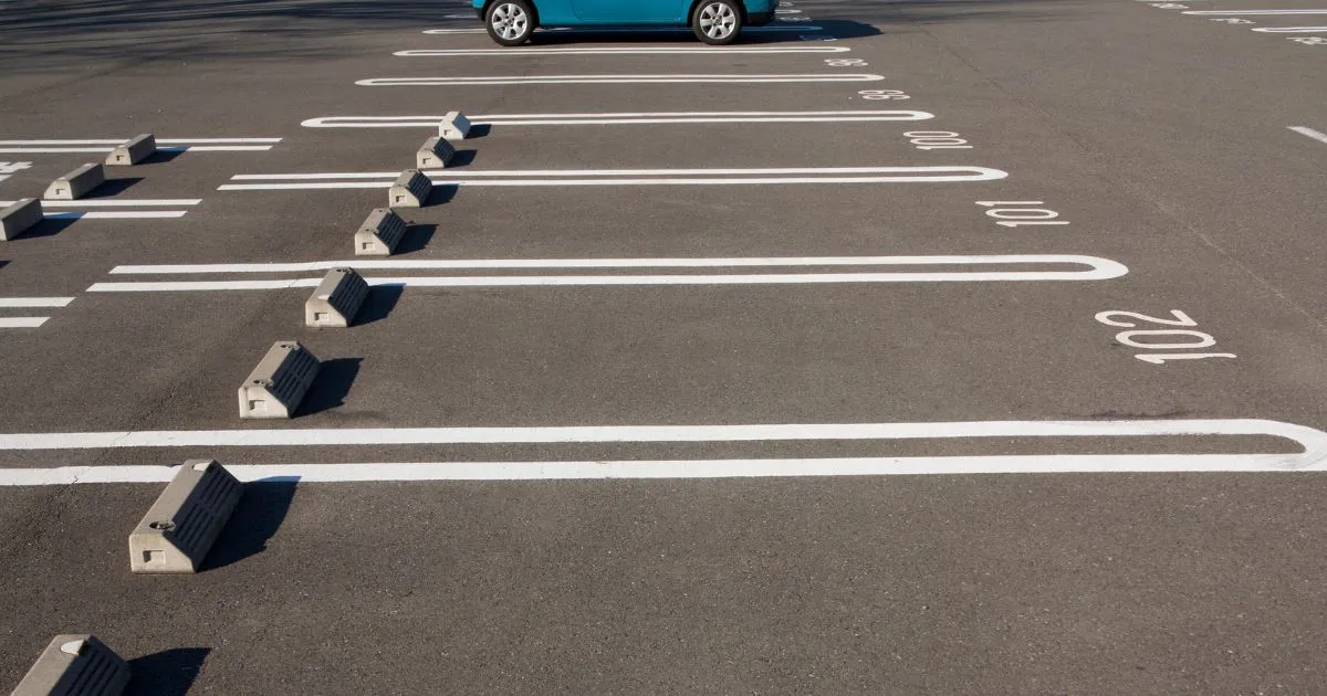 Empty Parking Spaces Available For Rent In An Uncovered Parking Garage