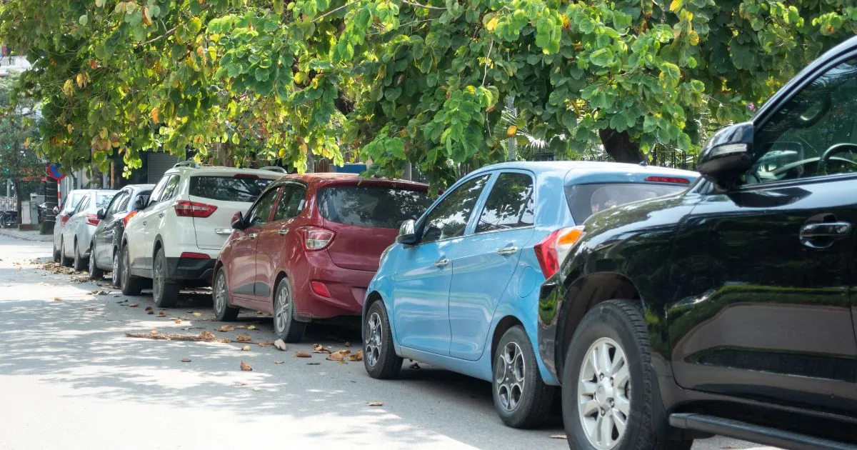 Multiple Parallel Parked Cars On A Street In The Autumn Season Multiple Parallel Parked Cars On A Street In The Autumn Season