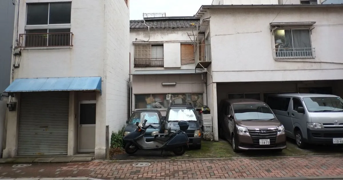 Multiple Vehicles Parked In A Residential Parking Space Rented Out To Their Owners By A Landlord