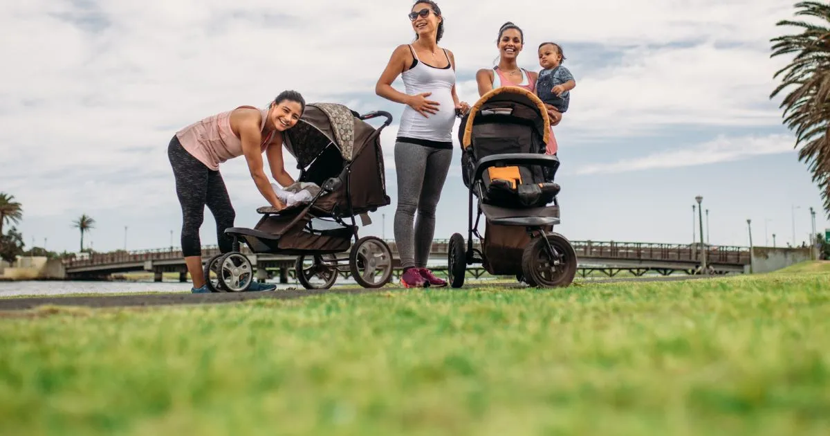 Parents With Prams In An Open Parking Space Parents With Prams In An Open Parking Space