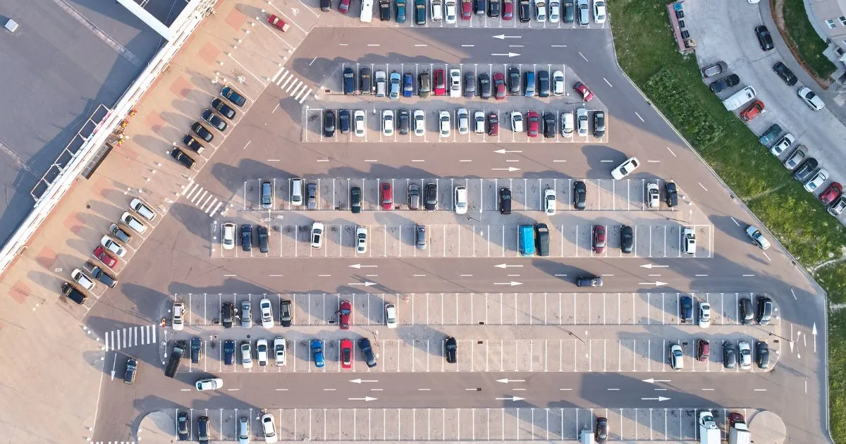 The Aerial View Of A Busy Parking Lot With Many Parked Vehicles The Aerial View Of A Busy Parking Lot With Many Parked Vehicles