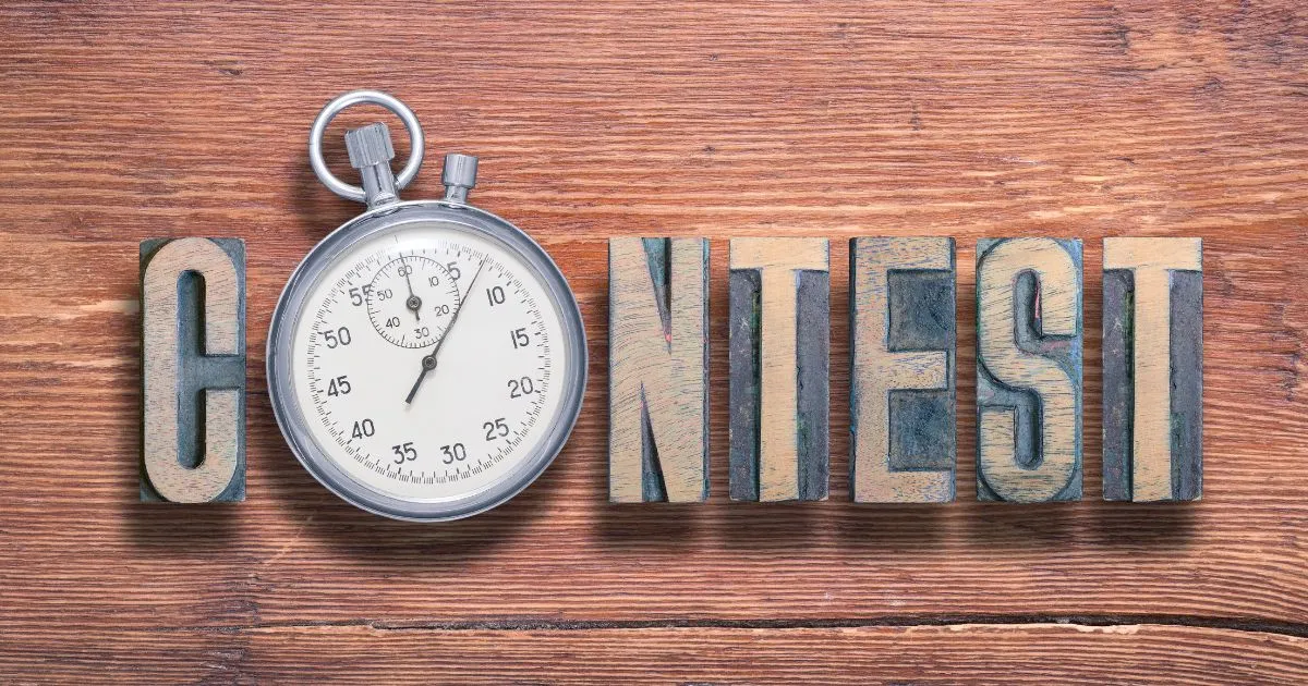 The Word Contest Creativty Written On A Wooden Slab The Word Contest Creativty Written On A Wooden Slab