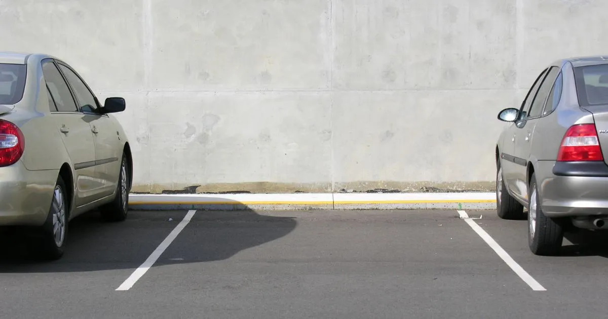 Two Filled And One Empty Parking Space In A Car Park Two Filled And One Empty Parking Space In A Car Park